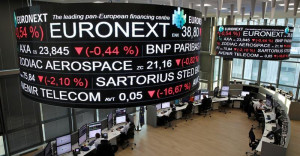 Company stock price information is displayed on screens as they hang above the Paris stock exchange, operated by Euronext NV, in La Defense business district in Paris, France, December 14, 2016. REUTERS/Benoit Tessier