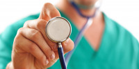 Doctor holding stethoscope (with shallow depth of field)